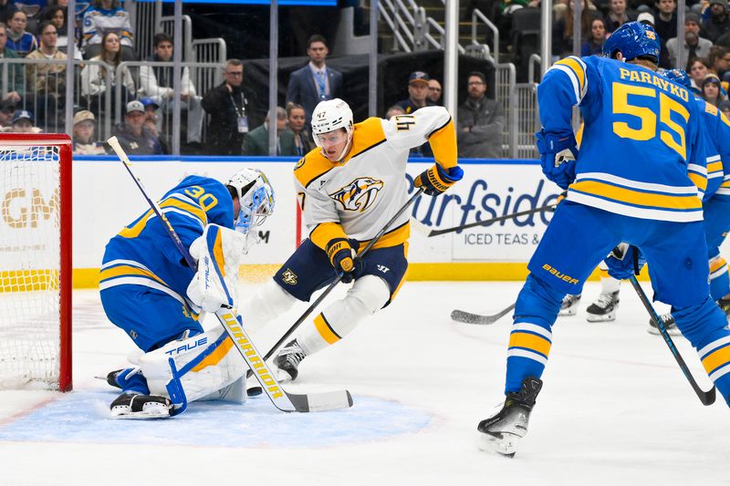 Dec 27, 2025; St. Louis, Missouri, USA; St. Louis Blues goaltender Joel Hofer (30) defends the net against Nashville Predators right wing Michael McCarron (47) during the first period at Enterprise Center. Mandatory Credit: Jeff Curry-Imagn Images
