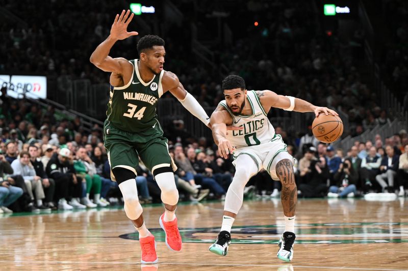 BOSTON, MASSACHUSETTS - OCTOBER 28: Jayson Tatum #0 of the Boston Celtics drives to the basket against Giannis Antetokounmpo #34 of the Milwaukee Bucks during the second half at the TD Garden on October 28, 2024 in Boston, Massachusetts. NOTE TO USER: User expressly acknowledges and agrees that, by downloading and or using this photograph, User is consenting to the terms and conditions of the Getty Images License Agreement. (Photo by Brian Fluharty/Getty Images)