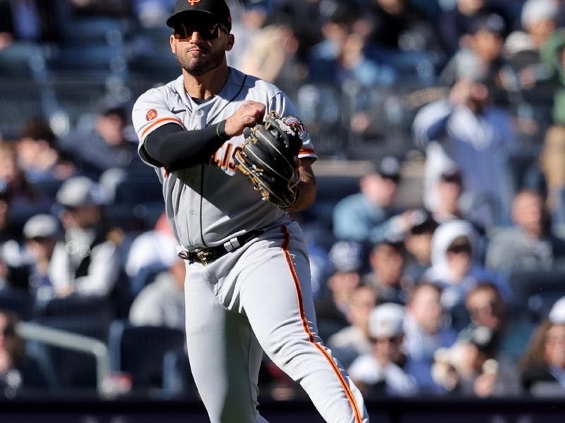 Apr 2, 2023; Bronx, New York, USA; San Francisco Giants third baseman David Villar (32) throws out New York Yankees center fielder Isiah Kiner-Falefa (not pictured) on a ground ball during the eighth inning at Yankee Stadium. Mandatory Credit: Brad Penner-USA TODAY Sports