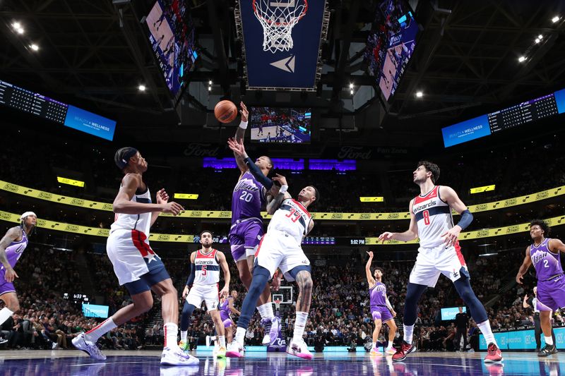 SALT LAKE CITY, UT - MARCH 4:  John Collins #20 of the Utah Jazz and Kyle Kuzma #33 of the Washington Wizards battle for a rebound on March 4, 2024 at vivint.SmartHome Arena in Salt Lake City, Utah. NOTE TO USER: User expressly acknowledges and agrees that, by downloading and or using this Photograph, User is consenting to the terms and conditions of the Getty Images License Agreement. Mandatory Copyright Notice: Copyright 2024 NBAE (Photo by Melissa Majchrzak/NBAE via Getty Images)