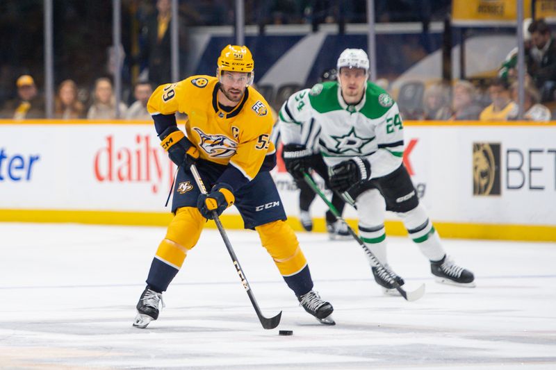 Feb 15, 2024; Nashville, Tennessee, USA; Nashville Predators defenseman Roman Josi (59) skates with the puck  against the Dallas Stars during the first period at Bridgestone Arena. Mandatory Credit: Steve Roberts-USA TODAY Sports