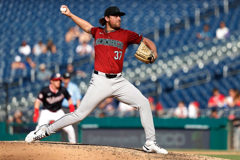 Jun 19, 2024; Washington, District of Columbia, USA; Arizona Diamondbacks relief pitcher Kevin Ginkel (37) pitches against the Washington Nationals during the seventh inning at Nationals Park. Mandatory Credit: Geoff Burke-USA TODAY Sports