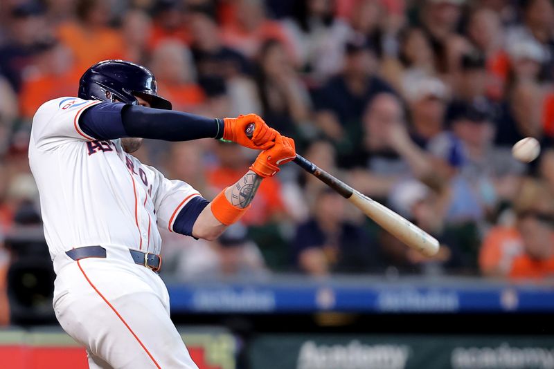 Jun 15, 2024; Houston, Texas, USA; Houston Astros catcher Victor Caratini (17) hits a triple to center field against the Detroit Tigers during the third inning at Minute Maid Park. Mandatory Credit: Erik Williams-USA TODAY Sports