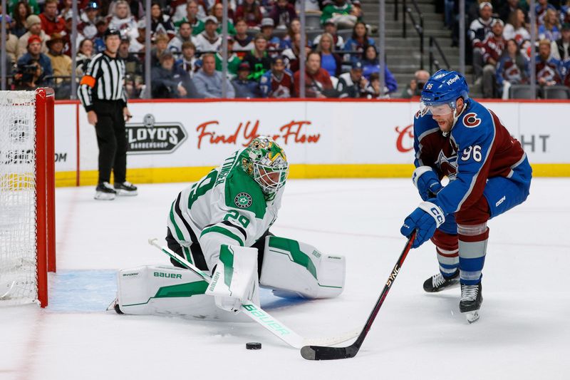 May 11, 2024; Denver, Colorado, USA; Dallas Stars goaltender Jake Oettinger (29) defends against Colorado Avalanche right wing Mikko Rantanen (96) in the second period in game three of the second round of the 2024 Stanley Cup Playoffs at Ball Arena. Mandatory Credit: Isaiah J. Downing-USA TODAY Sports