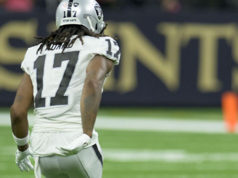 New Orleans Saints safety Tyrann Mathieu (32) makes an interception seen here next to New Orleans Saints wide receiver Kevin White (17) during the first half an NFL football game in New Orleans, Sunday, Oct. 30, 2022. (AP Photo/Matthew Hinton)