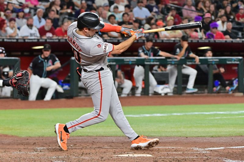 Sep 23, 2024; Phoenix, Arizona, USA;  San Francisco Giants shortstop Casey Schmitt (10) hits a solo home run in the fourth inning against the Arizona Diamondbacks at Chase Field. Mandatory Credit: Matt Kartozian-Imagn Images