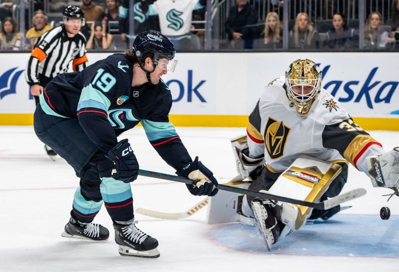 Nov 8, 2024; Seattle, Washington, USA;  Seattle Kraken forward Jared McCann (19) scores a goal against  Vegas Golden Knights goalie Adin Hill (33) in overtime at Climate Pledge Arena. Mandatory Credit: Stephen Brashear-Imagn Images