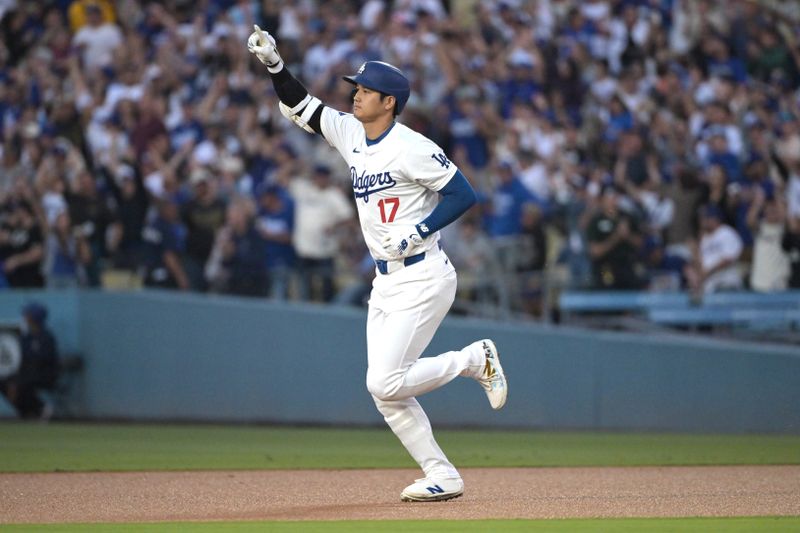 Aug 28, 2024; Los Angeles, California, USA;  Los Angeles Dodgers designated hitter Shohei Ohtani (17) rounds the bases after hitting a solo home run in the first inning against the Baltimore Orioles at Dodger Stadium. Mandatory Credit: Jayne Kamin-Oncea-USA TODAY Sports