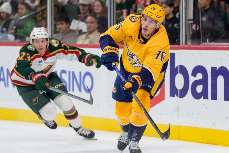 Nov 4, 2025; Saint Paul, Minnesota, USA; Nashville Predators defenseman Brady Skjei (76) clears the puck in front of Minnesota Wild center Marco Rossi (23) in the second period at Grand Casino Arena. Mandatory Credit: Matt Blewett-Imagn Images