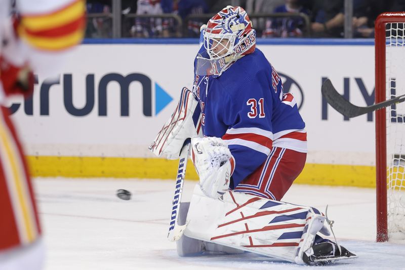 Feb 12, 2024; New York, New York, USA; New York Rangers goaltender Igor Shesterkin (31) makes a save against the Calgary Flames during the second period at Madison Square Garden. Mandatory Credit: Brad Penner-USA TODAY Sports