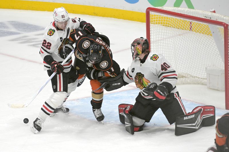 Mar 21, 2024; Anaheim, California, USA;  Chicago Blackhawks defenseman Nikita Zaitsev (22) and goaltender Arvid Soderblom (40) defend Anaheim Ducks left wing Alex Killorn (17) in the first period at Honda Center. Mandatory Credit: Jayne Kamin-Oncea-USA TODAY Sports