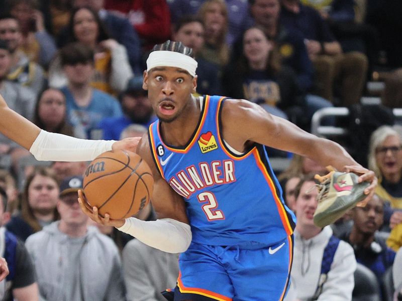 INDIANAPOLIS, INDIANA - MARCH 31:  Shai Gilgeous-Alexander #2 of the Oklahoma City Thunder reaches for a rebound while holding his shoe against Indiana Pacers at Gainbridge Fieldhouse on March 31, 2023 in Indianapolis, Indiana.    NOTE TO USER: User expressly acknowledges and agrees that, by downloading and/or using this photograph, User is consenting to the terms and conditions of the Getty Images License Agreement. (Photo by Andy Lyons/Getty Images)