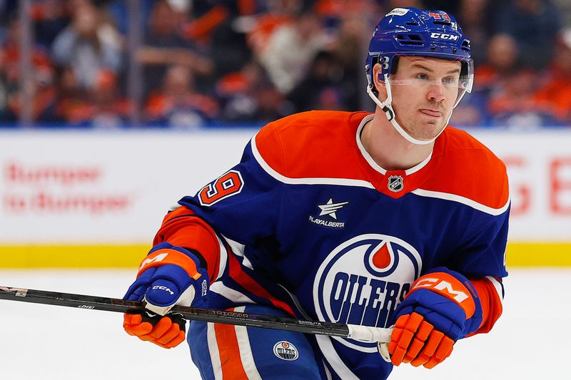 Jan 25, 2025; Edmonton, Alberta, CAN; Edmonton Oilers defensemen Ty Emberson (49) follows the play against the Buffalo Sabres at Rogers Place. Mandatory Credit: Perry Nelson-Imagn Images