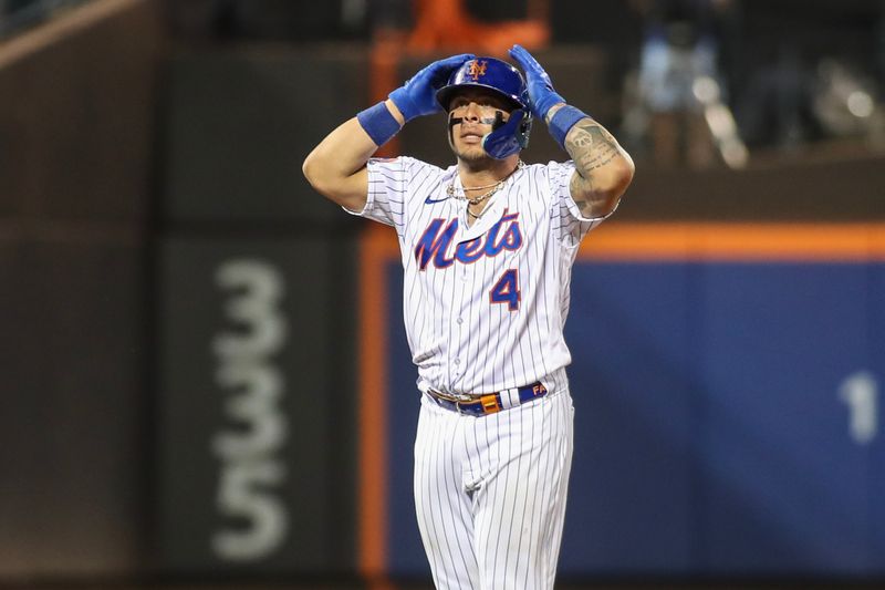 Sep 16, 2023; New York City, New York, USA; New York Mets catcher Francisco Alvarez (4) reacts after hitting an RBI double in the fourth inning against the Cincinnati Reds at Citi Field. Mandatory Credit: Wendell Cruz-USA TODAY Sports