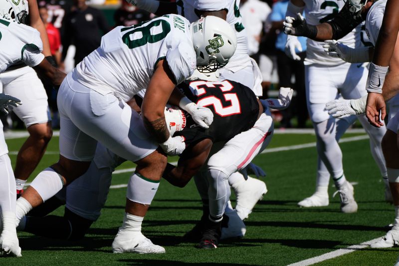 Nov 4, 2023; Waco, Texas, USA;  Houston Cougars running back Parker Jenkins (23) is stopped by Baylor Bears defensive lineman Treven Ma'ae (48) during the first half at McLane Stadium. Mandatory Credit: Chris Jones-USA TODAY Sports