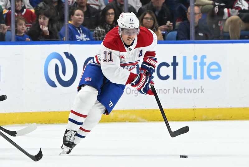 Nov 11, 2024; Buffalo, New York, USA; Montreal Canadiens right wing Brendan Gallagher (11) handles the puck in the first period against the Buffalo Sabres at KeyBank Center. Mandatory Credit: Mark Konezny-Imagn Images