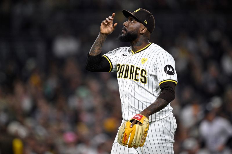 May 13, 2024; San Diego, California, USA; San Diego Padres relief pitcher Enyel De Los Santos (62) reacts after pitching the top of the eighth inning against the Colorado Rockies at Petco Park. Mandatory Credit: Orlando Ramirez-USA TODAY Sports