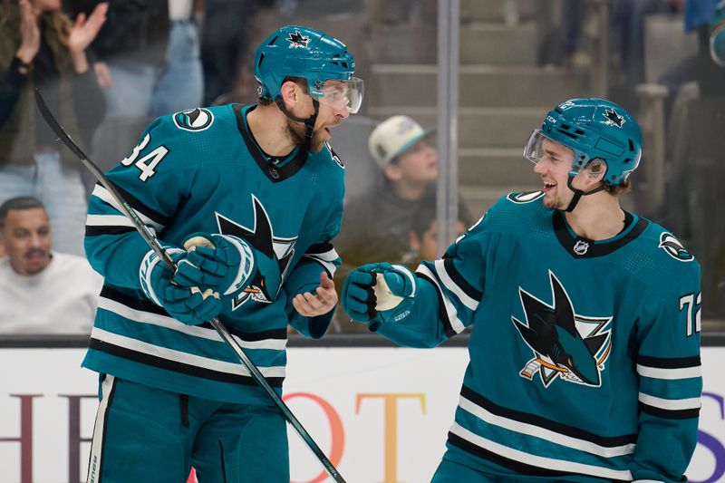 Jan 27, 2024; San Jose, California, USA; San Jose Sharks defenseman Jan Rutta (84) reacts with left wing William Eklund (72) after scoring a goal against the Buffalo Sabres during the first period at SAP Center at San Jose. Mandatory Credit: Robert Edwards-USA TODAY Sports