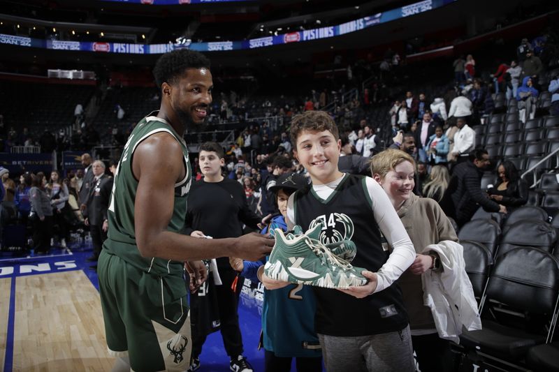 DETROIT, MI - JANUARY 22:  Malik Beasley #5 of the Milwaukee Bucks gives sneakers to fan after the game against the Detroit Pistons on January 22, 2024 at Little Caesars Arena in Detroit, Michigan. NOTE TO USER: User expressly acknowledges and agrees that, by downloading and/or using this photograph, User is consenting to the terms and conditions of the Getty Images License Agreement. Mandatory Copyright Notice: Copyright 2024 NBAE (Photo by Brian Sevald/NBAE via Getty Images)