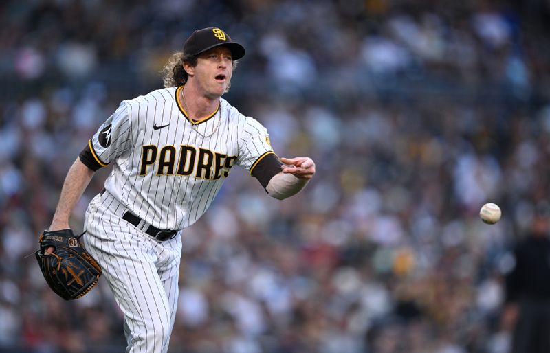 Jun 24, 2023; San Diego, California, USA; San Diego Padres relief pitcher Tim Hill (25) tosses the ball to first base on a ground out by Washington Nationals left fielder Corey Dickerson (not pictured) during the sixth inning at Petco Park. Mandatory Credit: Orlando Ramirez-USA TODAY Sports