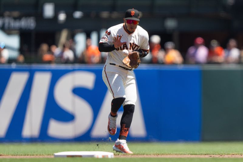 Aug 13, 2023; San Francisco, California, USA; San Francisco Giants second baseman Thairo Estrada (39) catches the ball during the fourth inning against the Texas Rangers at Oracle Park. Mandatory Credit: Stan Szeto-USA TODAY Sports