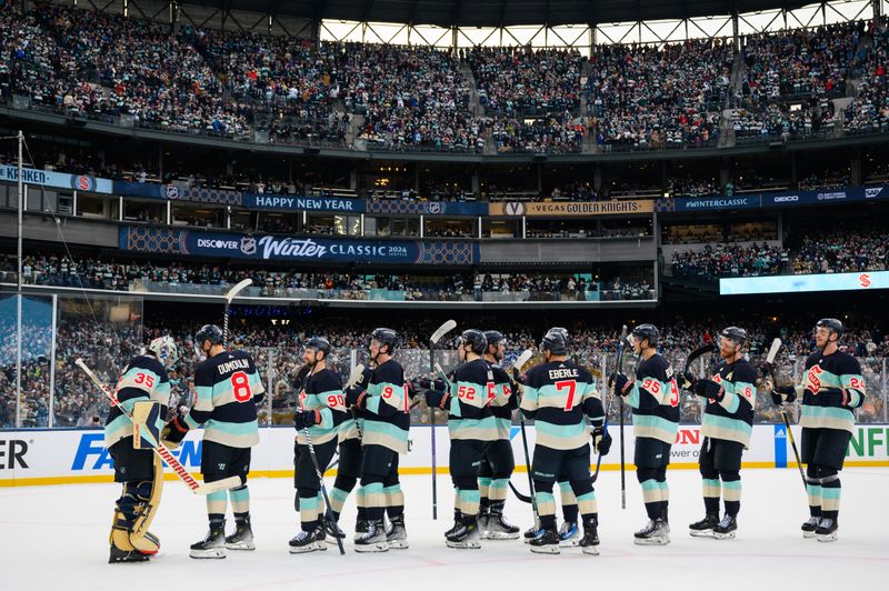 Jan 1, 2024; Seattle, Washington, USA; The Seattle Kraken celebrate after defeating the Vegas Golden Knights in the 2024 Winter Classic ice hockey game at T-Mobile Park. Mandatory Credit: Steven Bisig-USA TODAY Sports