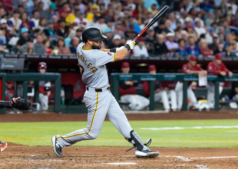 May 28, 2025; Phoenix, Arizona, USA; Pittsburgh Pirates infielder Isiah Kiner-Falefa hits a two run double in the sixth inning against the Arizona Diamondbacks at Chase Field. Mandatory Credit: Mark J. Rebilas-Imagn Images