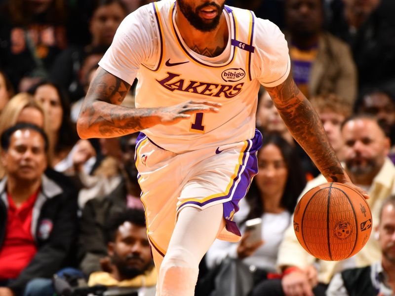 PHOENIX, AZ - NOVEMBER 26: D'Angelo Russell #1 of the Los Angeles Lakers dribbles the ball during the game against the Phoenix Suns during the Emirates NBA Cup game on November 26, 2024 at Footprint Center in Phoenix, Arizona. NOTE TO USER: User expressly acknowledges and agrees that, by downloading and or using this photograph, user is consenting to the terms and conditions of the Getty Images License Agreement. Mandatory Copyright Notice: Copyright 2024 NBAE (Photo by Barry Gossage/NBAE via Getty Images)