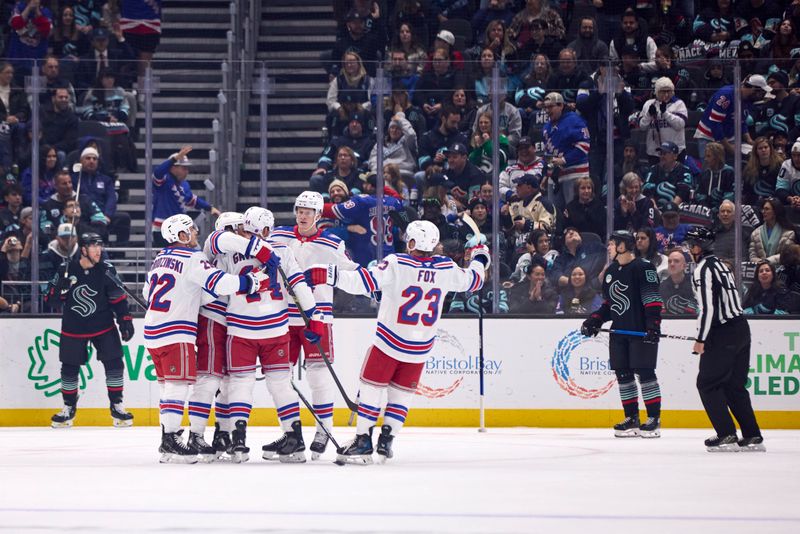Nov 1, 2025; Seattle, Washington, USA; The New York Rangers celebrate after scoring a goal during the first period against the Seattle Kraken at Climate Pledge Arena. Mandatory Credit: Blake Dahlin-Imagn Images