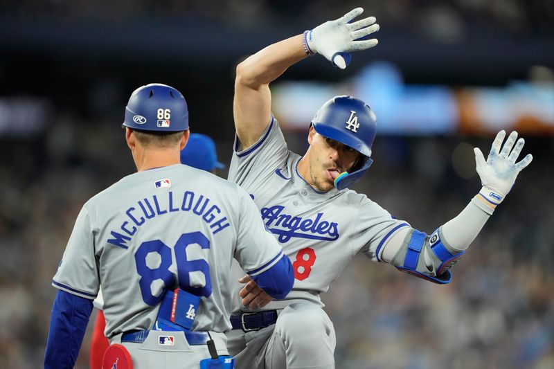 Apr 27, 2024; Toronto, Ontario, CAN; Los Angeles Dodgers third baseman Enrique Hernandez (8) reacts after reaching first base on a single against the Los Angeles Dodgers during the second inning at Rogers Centre. Mandatory Credit: John E. Sokolowski-USA TODAY Sports