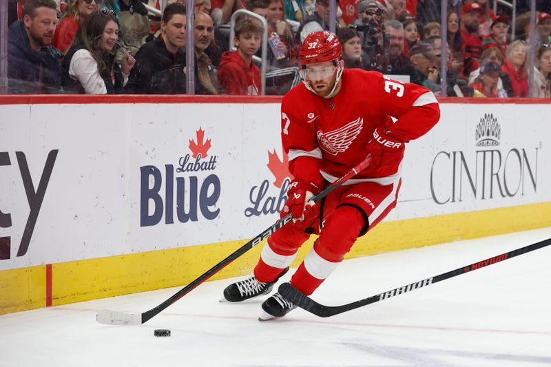 Mar 16, 2024; Detroit, Michigan, USA;  Detroit Red Wings left wing J.T. Compher (37) skates with the puck in the second period against the Buffalo Sabres at Little Caesars Arena. Mandatory Credit: Rick Osentoski-USA TODAY Sports