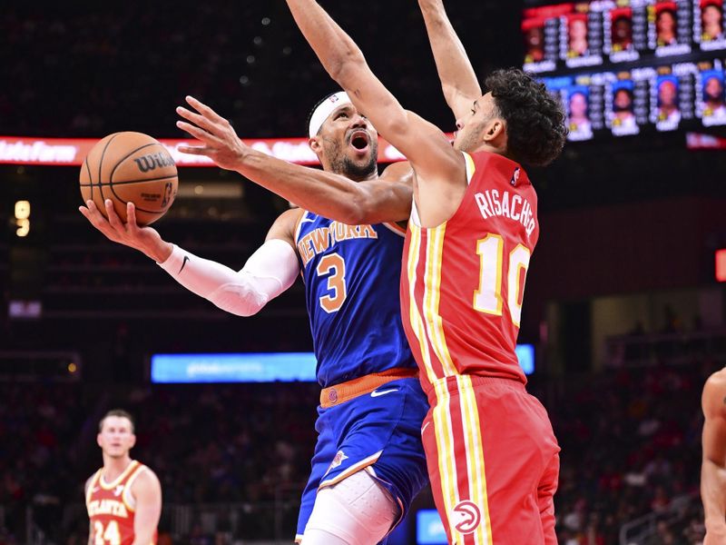 ATLANTA, GA - November 6:  Josh Hart #3 of the New York Knicks shoots the ball during the game against the Atlanta Hawks on November 6, 2024 at State Farm Arena in Atlanta, Georgia.  NOTE TO USER: User expressly acknowledges and agrees that, by downloading and/or using this Photograph, user is consenting to the terms and conditions of the Getty Images License Agreement. Mandatory Copyright Notice: Copyright 2024 NBAE (Photo by Adam Hagy/NBAE via Getty Images)