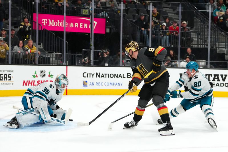 Dec 10, 2023; Las Vegas, Nevada, USA; San Jose Sharks goaltender Kaapo Kahkonen (36) makes a save against Vegas Golden Knights center Jack Eichel (9) as San Jose Sharks left wing Fabian Zetterlund (20) defends against the play during an overtime period at T-Mobile Arena. Mandatory Credit: Stephen R. Sylvanie-USA TODAY Sports