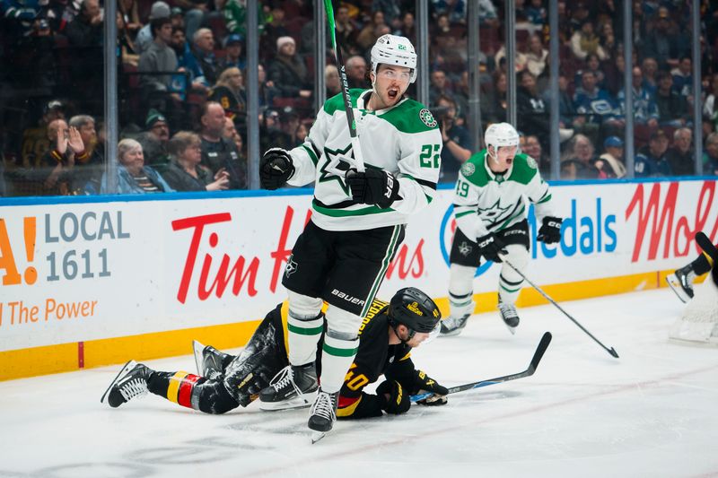 Nov 20, 2025; Vancouver, British Columbia, CAN; Vancouver Canucks forward Elias Pettersson (40) reacts as Dallas Stars forward Mavrik Bourque (22) celebrates his goal in the first period at Rogers Arena. Mandatory Credit: Bob Frid-Imagn Images