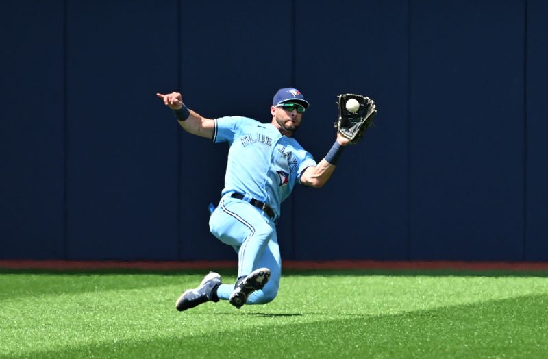 Jun 1, 2023; Toronto, Ontario, CAN;   Toronto Blue Jays center fielder Kevin Kiermaier (39) catches a fly ball hit by Milwaukee Brewers left fielder Tyrone Taylor (not shown) in the fifth inning at Rogers Centre. Mandatory Credit: Dan Hamilton-USA TODAY Sports