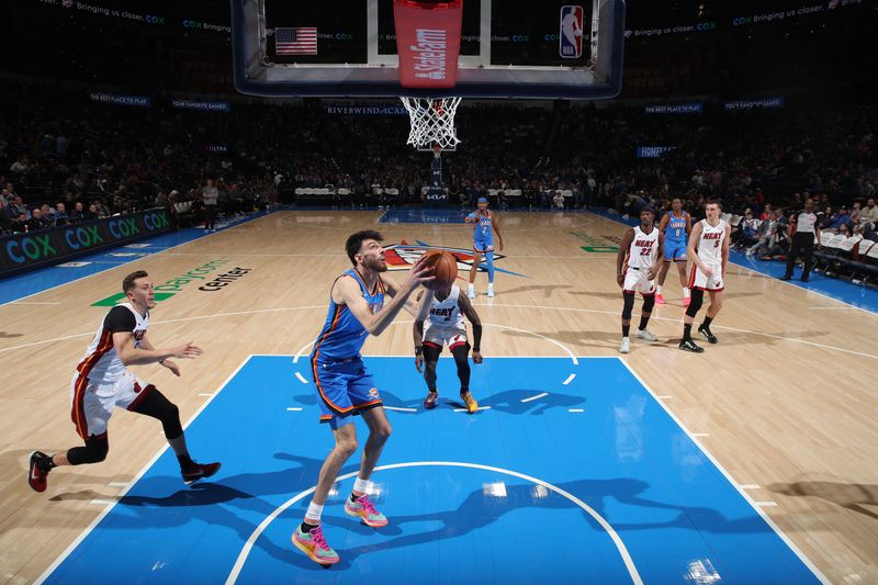 OKLAHOMA CITY, OK - MARCH 8:  Chet Holmgren #7 of the Oklahoma City Thunder handles the ball during the game against the Miami Heat on March 8, 2024 at Paycom Arena in Oklahoma City, Oklahoma. NOTE TO USER: User expressly acknowledges and agrees that, by downloading and or using this photograph, User is consenting to the terms and conditions of the Getty Images License Agreement. Mandatory Copyright Notice: Copyright 2024 NBAE (Photo by Zach Beeker/NBAE via Getty Images)