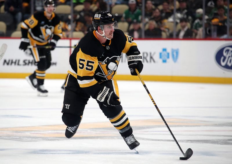 Nov 11, 2024; Pittsburgh, Pennsylvania, USA;  Pittsburgh Penguins center Noel Acciari (55) skates with the puck against the Dallas Stars during the third period at PPG Paints Arena. Mandatory Credit: Charles LeClaire-Imagn Images