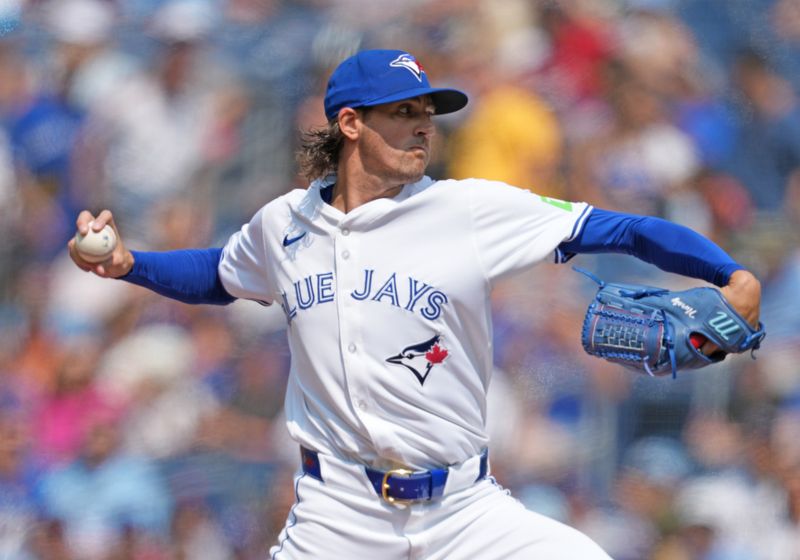 Jul 27, 2024; Toronto, Ontario, CAN; Toronto Blue Jays starting pitcher Kevin Gausman (34) throws a pitch against the Texas Rangers during the first inning at Rogers Centre. Mandatory Credit: Nick Turchiaro-USA TODAY Sports