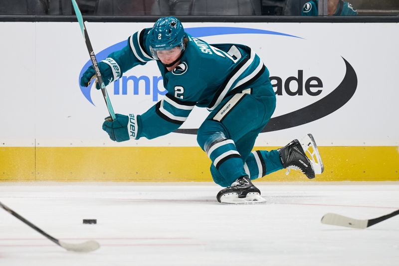 Oct 1, 2025; San Jose, California, USA; San Jose Sharks center Will Smith (2) watches the puck as he falls to the ice against the Anaheim Ducks during the second period at SAP Center at San Jose. Mandatory Credit: Robert Edwards-Imagn Images