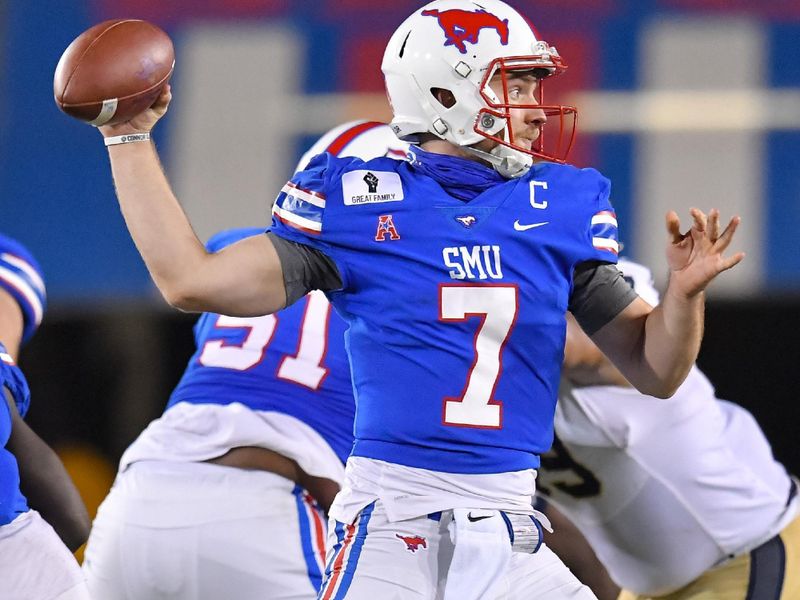 Oct 31, 2020; Dallas, Texas, USA; Southern Methodist Mustangs quarterback Shane Buechele (7) looks down field against Navy Midshipmen during the first half at Gerald J. Ford Stadium. Mandatory Credit: Tim Flores-USA TODAY Sports