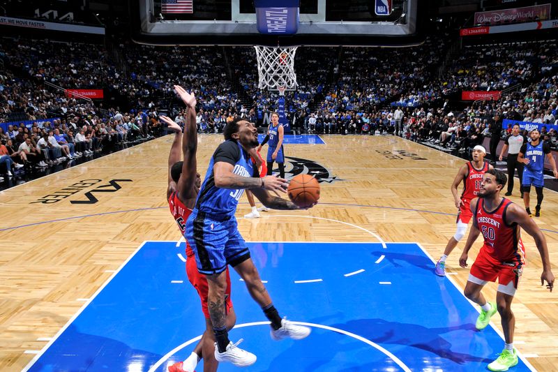 ORLANDO, FL - NOVEMBER 8: Cole Anthony #50 of the Orlando Magic drives to the basket during the game against the New Orleans Pelicans on November 8, 2024 at the Kia Center in Orlando, Florida. NOTE TO USER: User expressly acknowledges and agrees that, by downloading and or using this photograph, User is consenting to the terms and conditions of the Getty Images License Agreement. Mandatory Copyright Notice: Copyright 2024 NBAE (Photo by Fernando Medina/NBAE via Getty Images)