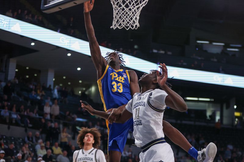 Jan 23, 2024; Atlanta, Georgia, USA; Pittsburgh Panthers center Federiko Federiko (33) shoots past Georgia Tech Yellow Jackets forward Baye Ndongo (11) in the first half at McCamish Pavilion. Mandatory Credit: Brett Davis-USA TODAY Sports
