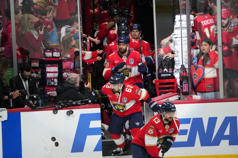 Jun 9, 2025; Sunrise, Florida, USA; Florida Panthers forward Brad Marchand (63) knocks down the pucks for warm up prior to the first period against the Edmonton Oilers in game three of the 2025 Stanley Cup Final at Amerant Bank Arena. Mandatory Credit: Jim Rassol-Imagn Images