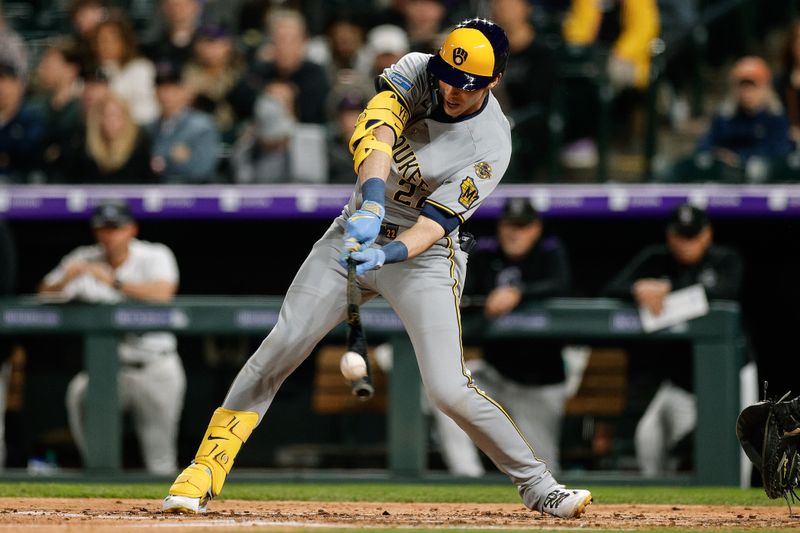 Apr 9, 2025; Denver, Colorado, USA; Milwaukee Brewers designated hitter Christian Yelich (22) hits a single in the fifth inning against the Colorado Rockies at Coors Field. Mandatory Credit: Isaiah J. Downing-Imagn Images