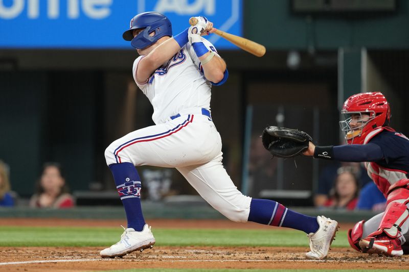 Sep 20, 2023; Arlington, Texas, USA; Texas Rangers third baseman Josh Jung (6) follows through on his single against the Boston Red Sox during the second inning at Globe Life Field. Mandatory Credit: Jim Cowsert-USA TODAY Sports