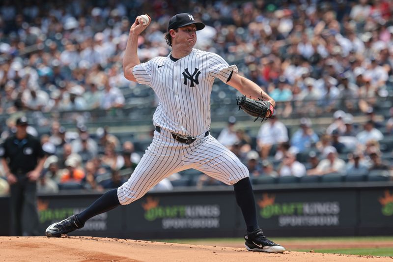 Jul 6, 2024; Bronx, New York, USA; New York Yankees starting pitcher Gerrit Cole (45) delivers a pitch during the first inning against the Boston Red Sox at Yankee Stadium. Mandatory Credit: Vincent Carchietta-USA TODAY Sports