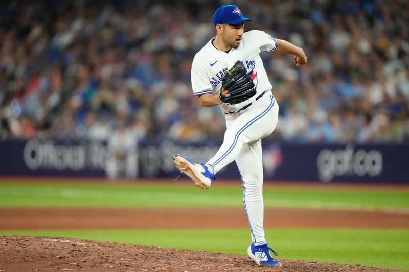 Aug 15, 2023; Toronto, Ontario, CAN; Toronto Blue Jays starting pitcher Yusei Kikuchi (16) follows through with a pitch during the sixth inning against the Philadelphia Phillies at Rogers Centre. Mandatory Credit: John E. Sokolowski-USA TODAY Sports