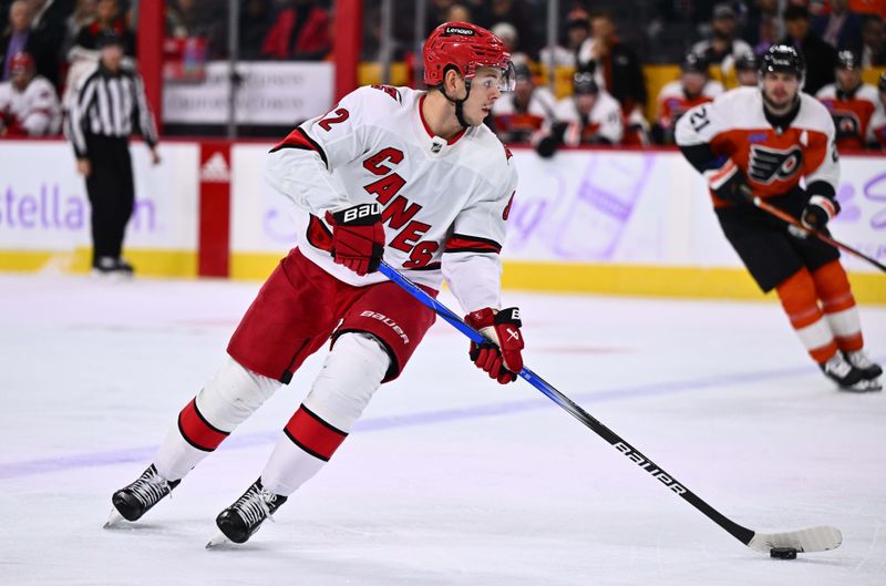 Nov 28, 2023; Philadelphia, Pennsylvania, USA; Carolina Hurricanes center Jesperi Kotkaniemi (82) controls the puck against the Philadelphia Flyers in the third period at Wells Fargo Center. Mandatory Credit: Kyle Ross-USA TODAY Sports