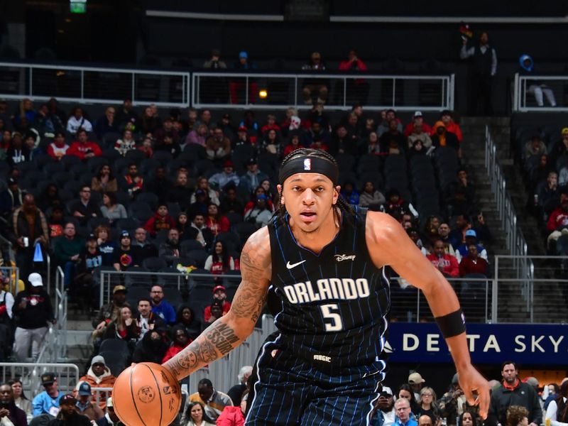 ATLANTA, GA - JANUARY 17: Paolo Banchero #5 of the Orlando Magic goes to the basket during the game on January 17, 2024 at State Farm Arena in Atlanta, Georgia.  NOTE TO USER: User expressly acknowledges and agrees that, by downloading and/or using this Photograph, user is consenting to the terms and conditions of the Getty Images License Agreement. Mandatory Copyright Notice: Copyright 2024 NBAE (Photo by Scott Cunningham/NBAE via Getty Images)