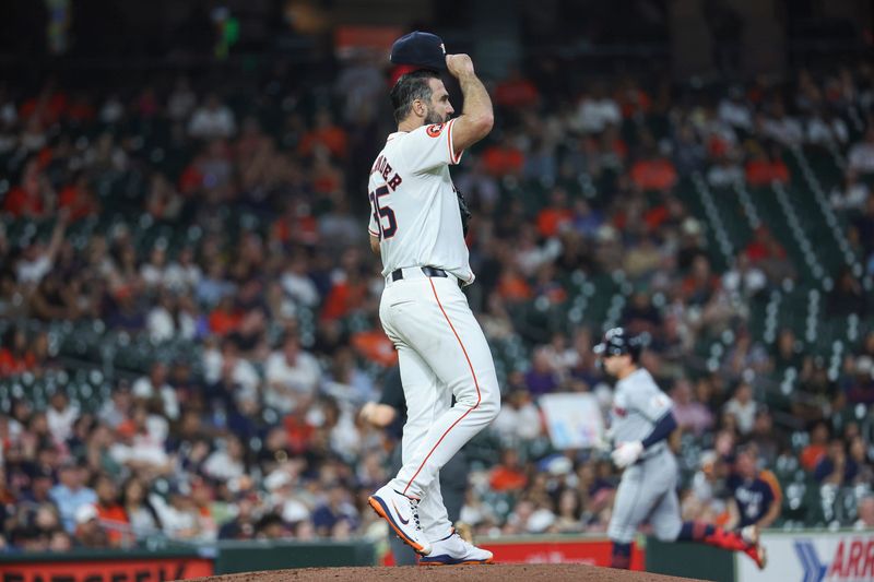 May 1, 2024; Houston, Texas, USA;  Houston Astros starting pitcher Justin Verlander (35) reacts and Cleveland Guardians designated hitter Will Brennan (17) rounds the bases after hitting a home run during the fifth inning at Minute Maid Park. Mandatory Credit: Troy Taormina-USA TODAY Sports